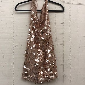 Backless rose gold sequin mini dress.